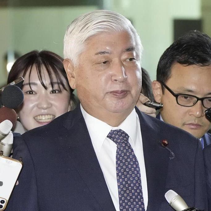 Japan's defense chief steps aboard visiting South Korean warship as the two nations strengthen ties